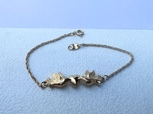 Avon 2 doves with heart bracelet