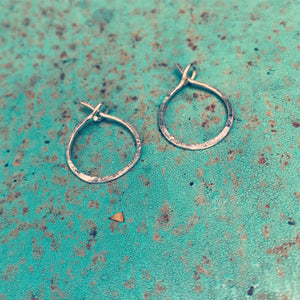 small continuous hoops (gold or silver)