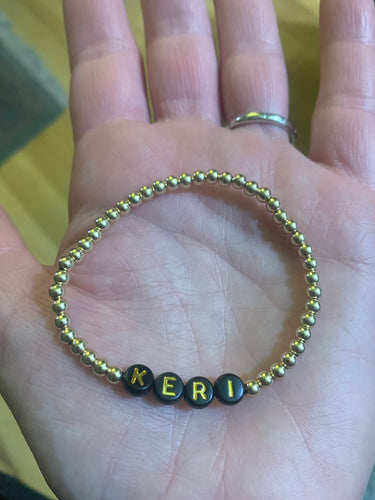 Gold beaded name bracelet