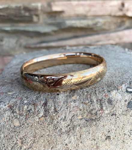 Gold bangle etched “Hazel”