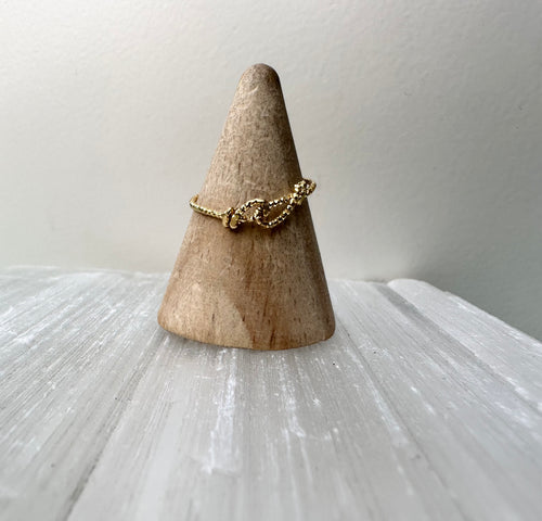 Faceted brass love knot ring
